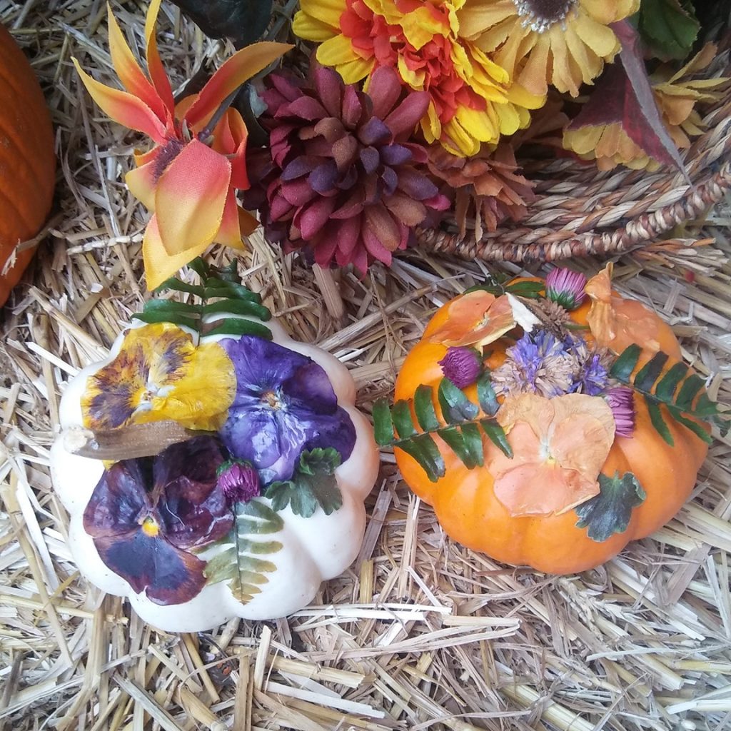 mini pumpkins decoupaged with flowers and fern leaves